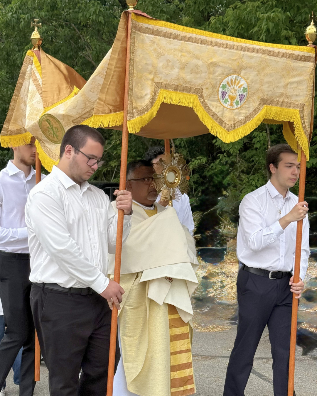 Etobicoke: Fr. Raja carries the monstrance.