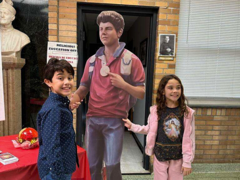 Kids with a cutout of Bl. Carlo Actuis at St. John Bosco Parish, Port Chester, NY