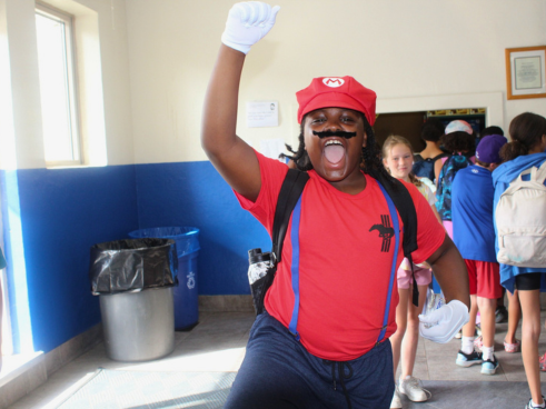 "Mario" cheers during "Superhero Week" at Camp Echo Bay