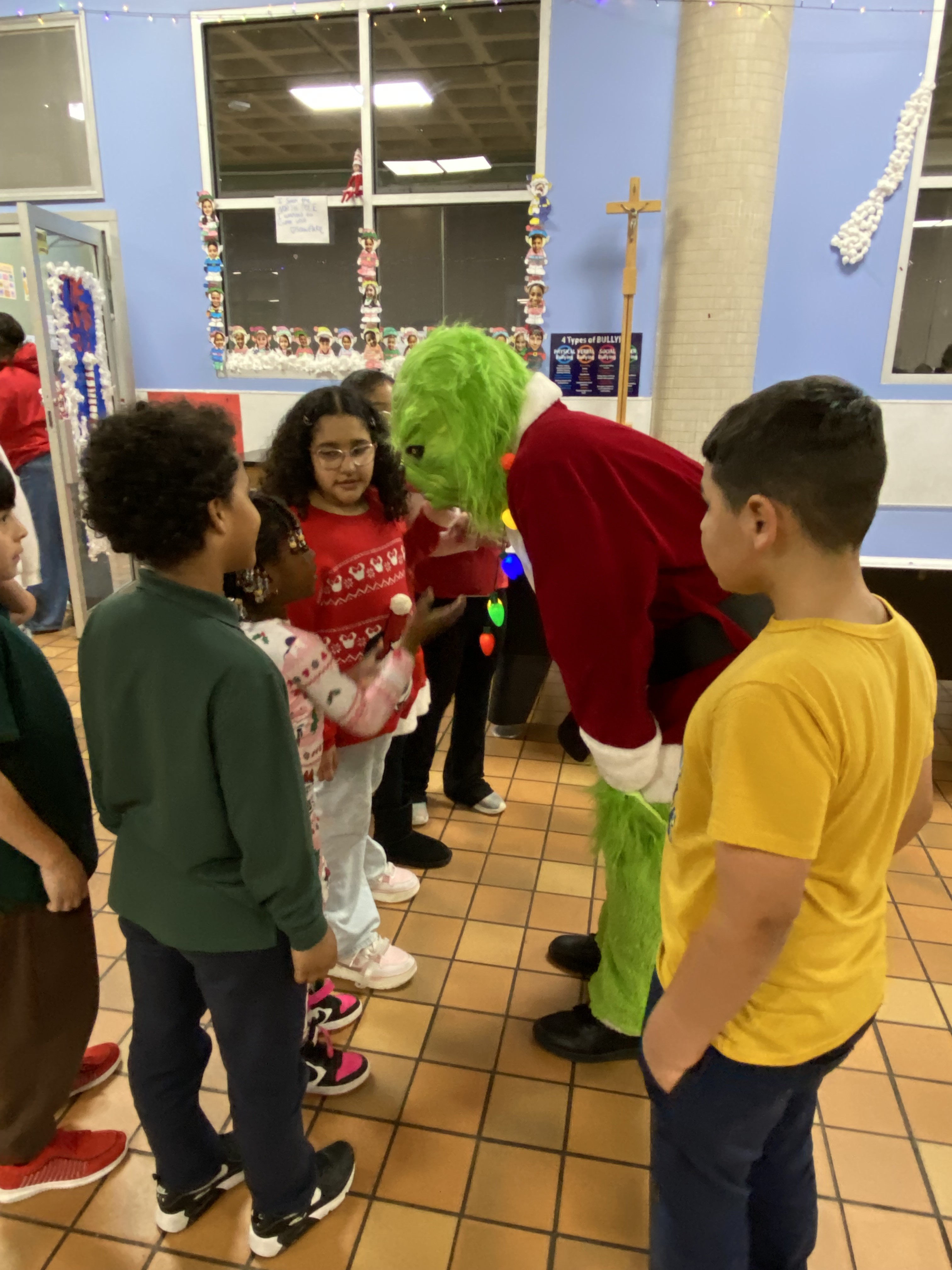 East Boston: The Grinch visits youths at the Club.
