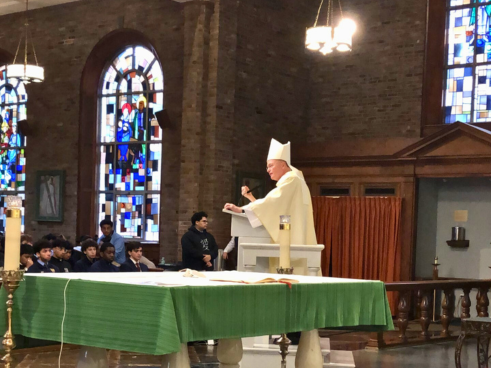 Bishop Edmund James Whalen speaks to Salesian High students