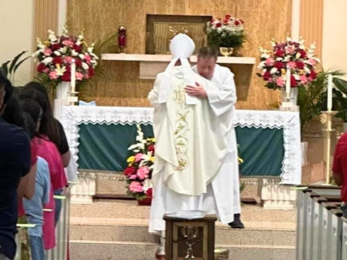 Most Rev. Kevin Birmingham, Auxiliary Bishop of Chicago, and Fr. Richard Alejunas, SDB, embrace