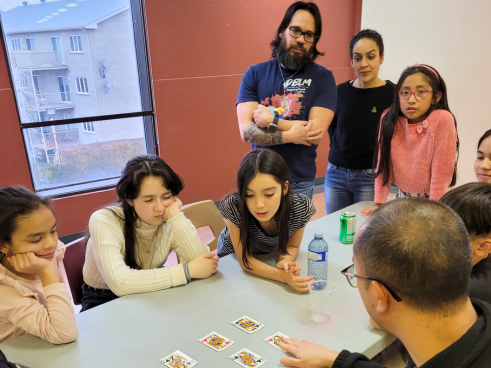 Provincial Fr. Dominic Tran, SDB, entertains young people with card tricks in the spirit of Don Bosco, patron saint of magicians.