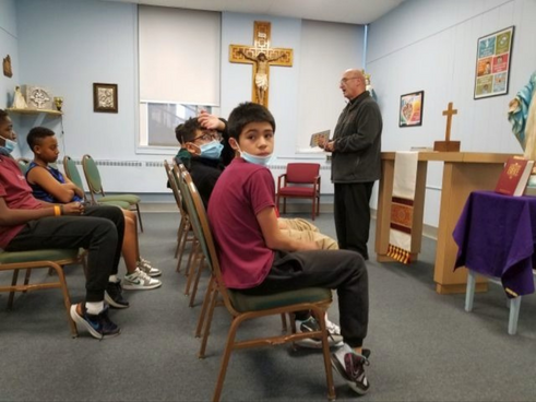 Fr. Bill Bucciferro (standing) instructs a faith time orientation