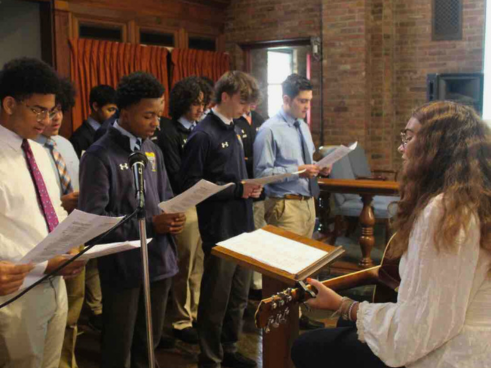 Interim Province Delegate of Youth and Young Adult Ministry Ms. Vicky Weekley (right) leads the Salesian High choir