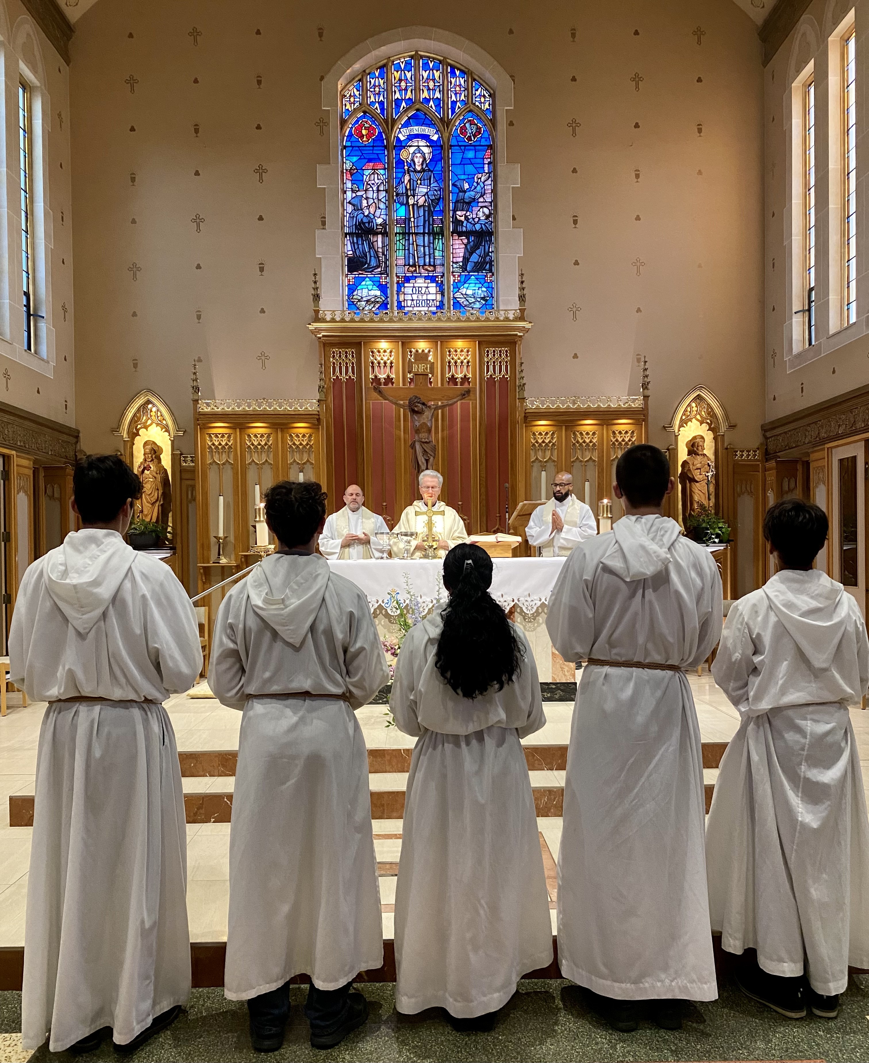 Altar servers and Salesian priests at the Etobicoke feast day Mass