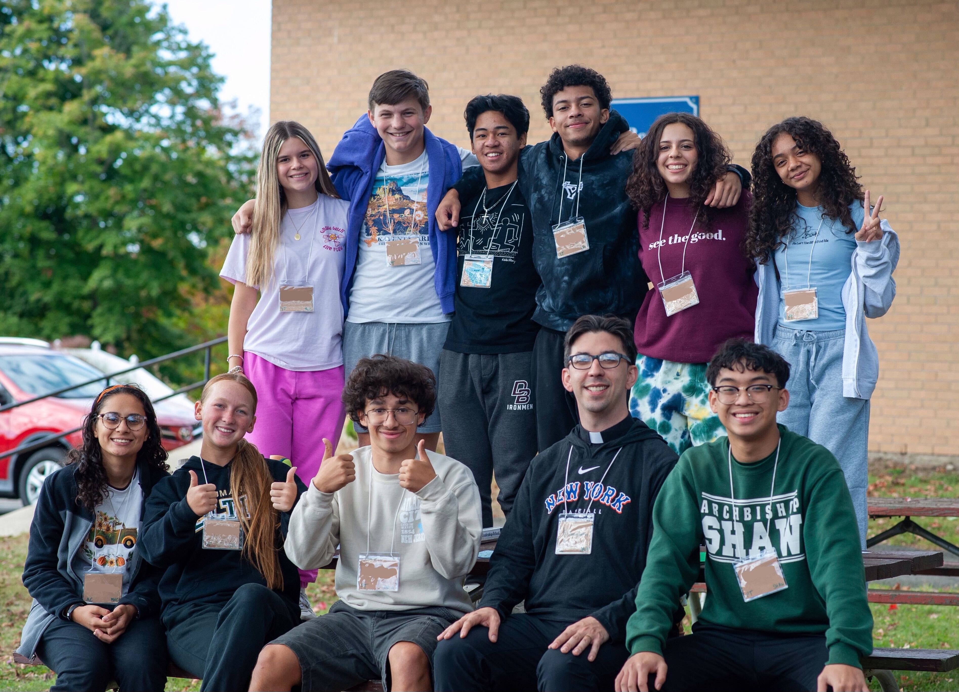 Fr. Lenny Carlino, SDB, poses with his small group for a photo.