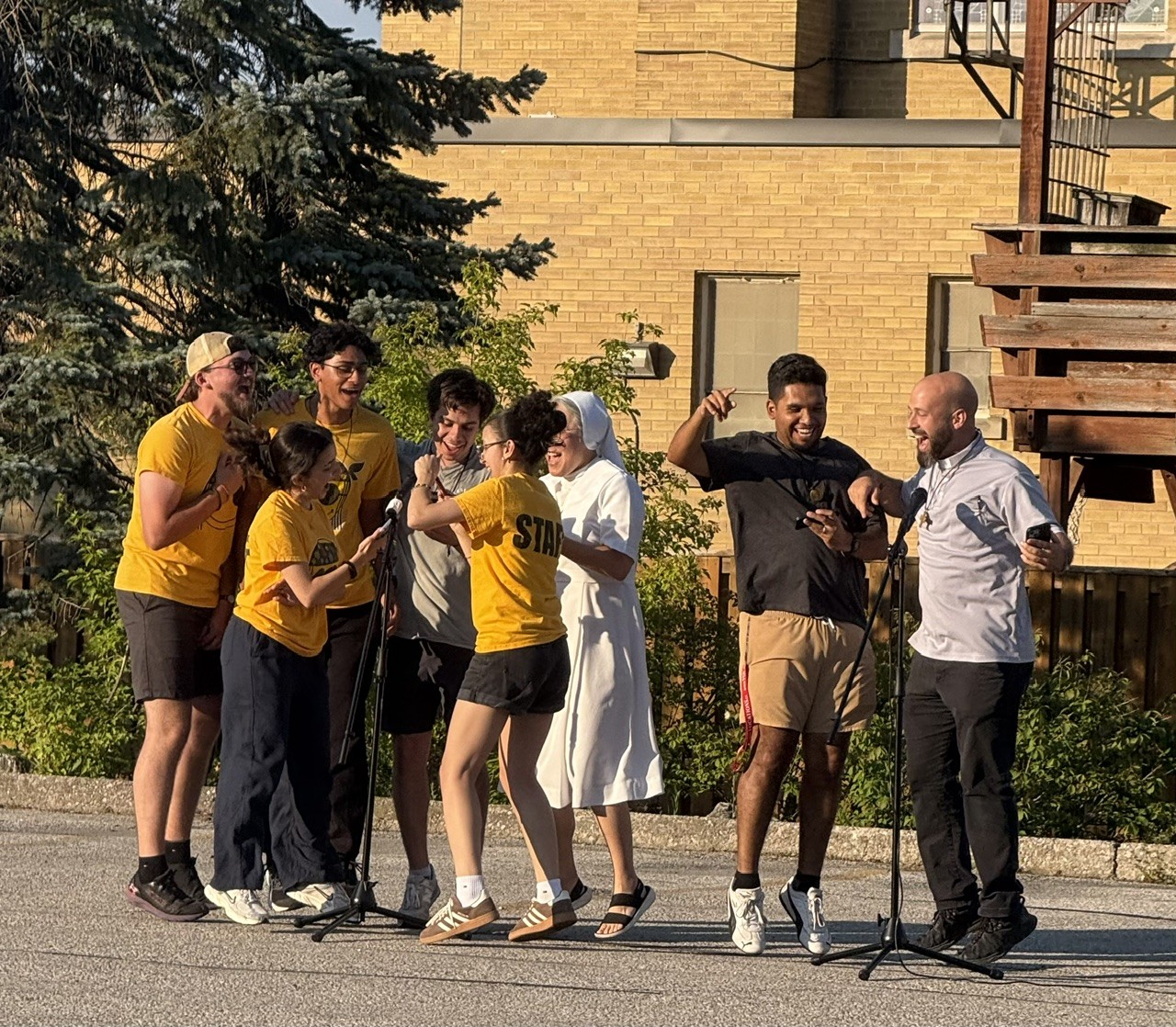 Etobicoke: Sr. Hae-Jin Lim, FMA; Bro. Carlos Cerda, SDB; and Fr. Steve DeMaio, SDB, sing karaoke with SummerDaze Camp staff.