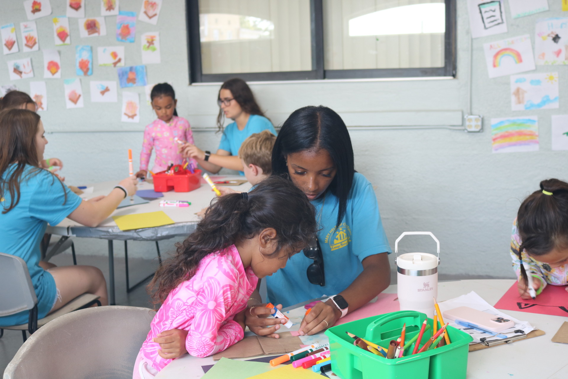 Tampa: Youths at Camp Mary Help create crafts.