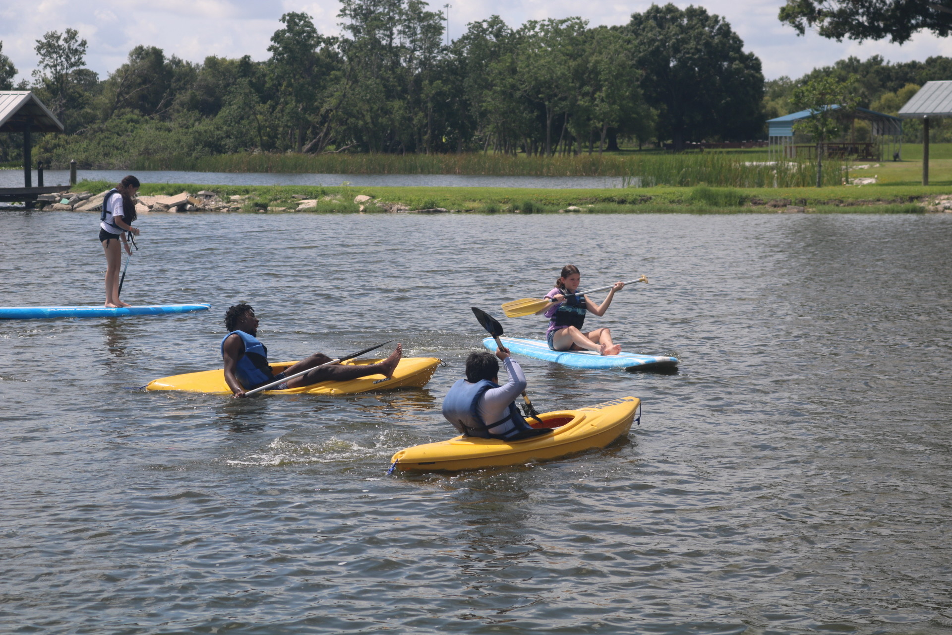 Tampa: Campers at Camp Mary Help kayak on the lake.