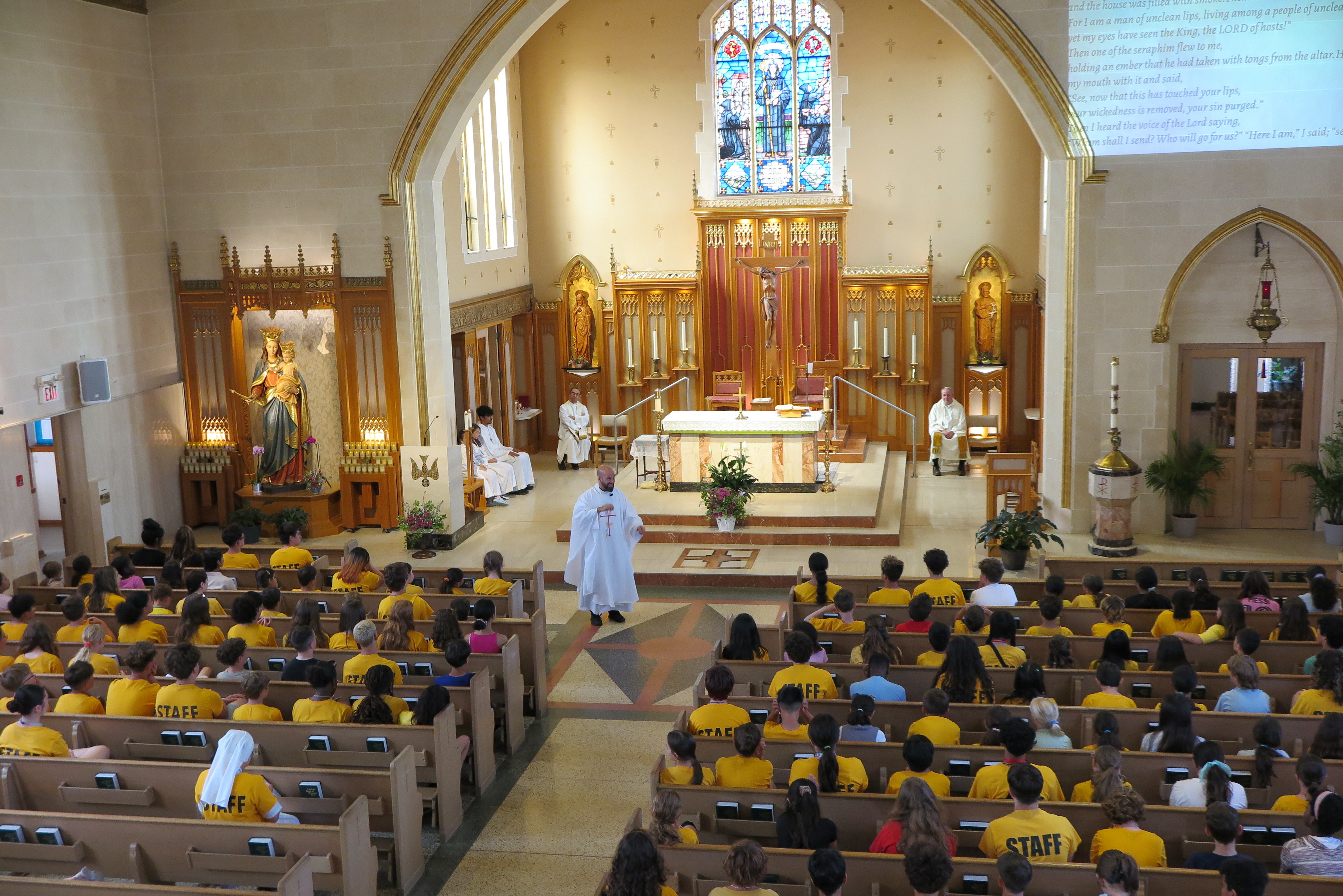 Etobicoke: Fr. Steve DeMaio, SDB, gives a homily during Mass for SummerDaze staff and campers.