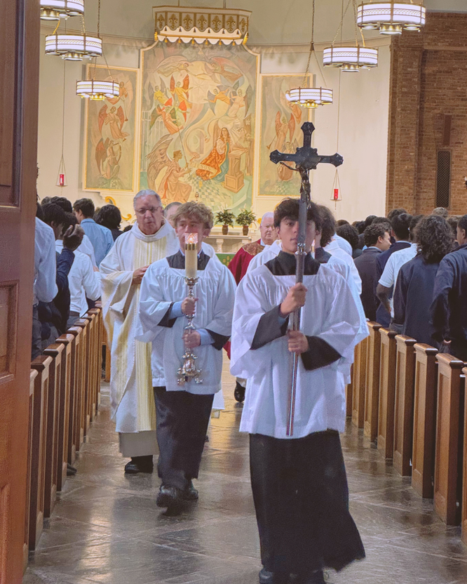 New Rochelle: Altar servers lead the way at the conclusion of Salesian High’s Mass of the Holy Spirit.