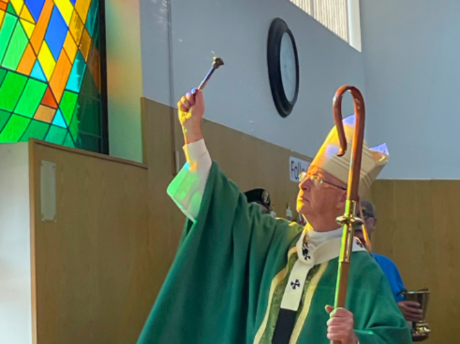 Most Rev. Richard W. Smith, Archbishop of Edmonton, blesses the new stained glass window