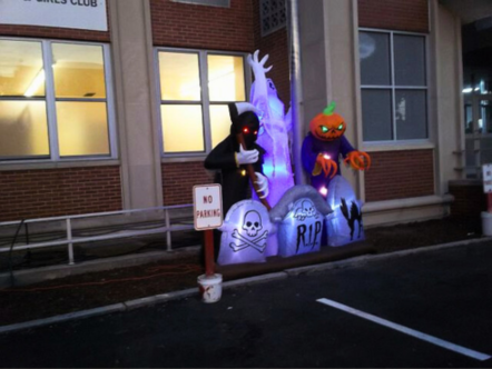 “Haunted greeters” welcome guests to the trunk-or-treat in East Boston.