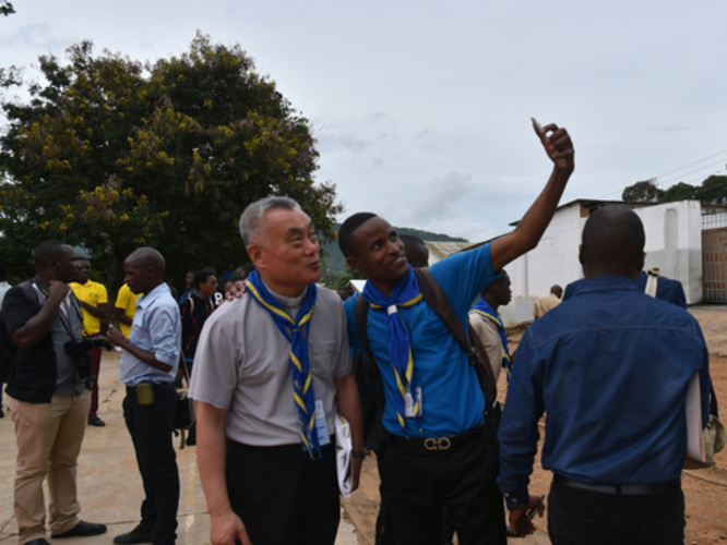 Fr. Gus takes a selfie with a young man in Africa