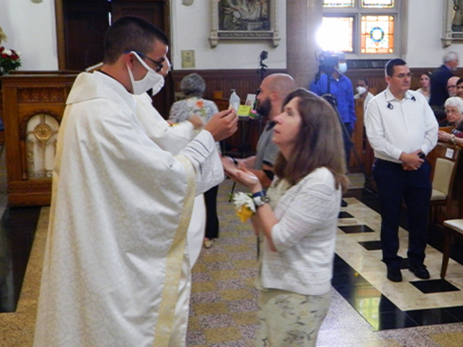 Fr. Lenny Gives Communion to his Mother