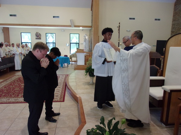 At the end of Mass, Fr. Dominic gives the special blessing to the newly professed brothers.