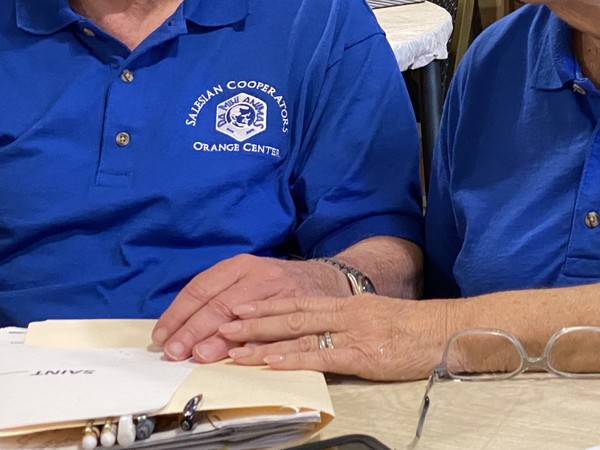 Jim and Paula join hands during a Cooperators’ meeting.