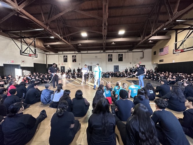 DBCR students perform and watch a rope activity in the gym.