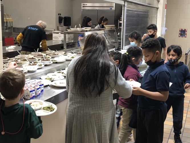 Maria handing out meals