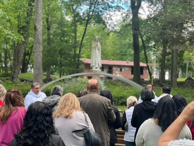 Fr. Manny Gallo, SDB (left), leads the procession to the Shrine of Our Lady of Guadalupe with the Rosary of Hope and Blessing of Mary Help of Christians in Stony Point, NY.