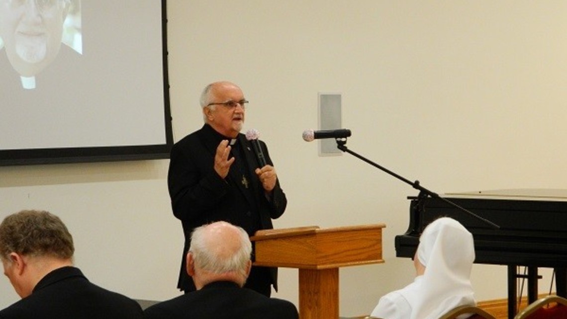 Fr Tim Plock addressing assembly