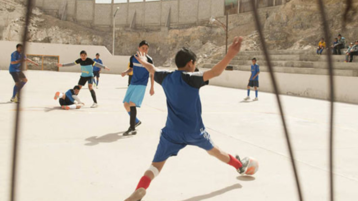 Kids playing soccer at a Salesian youth center in Ciudad Juarez