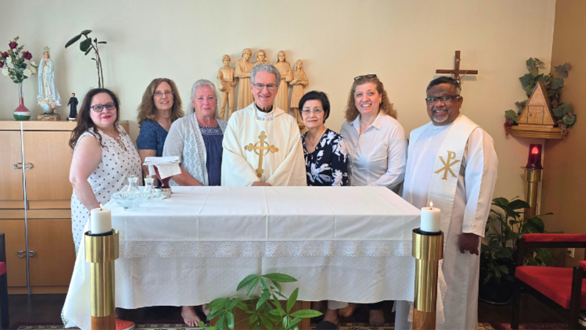 Salesian Cooperators Edmonton with Fr. John Puntino, SDB (center) | Credit: Anne Harding Banner Days for Salesian Family in Canada