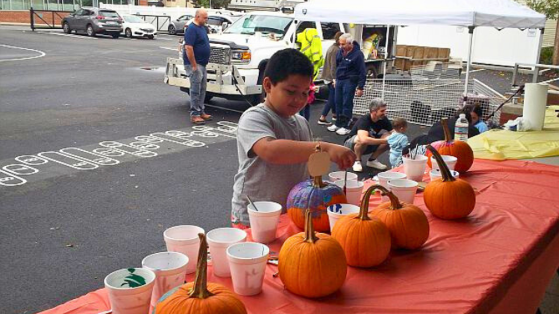 A club member paints a pumpkin. | Photo by Br. Bob Metell, SDB East Boston October Updates