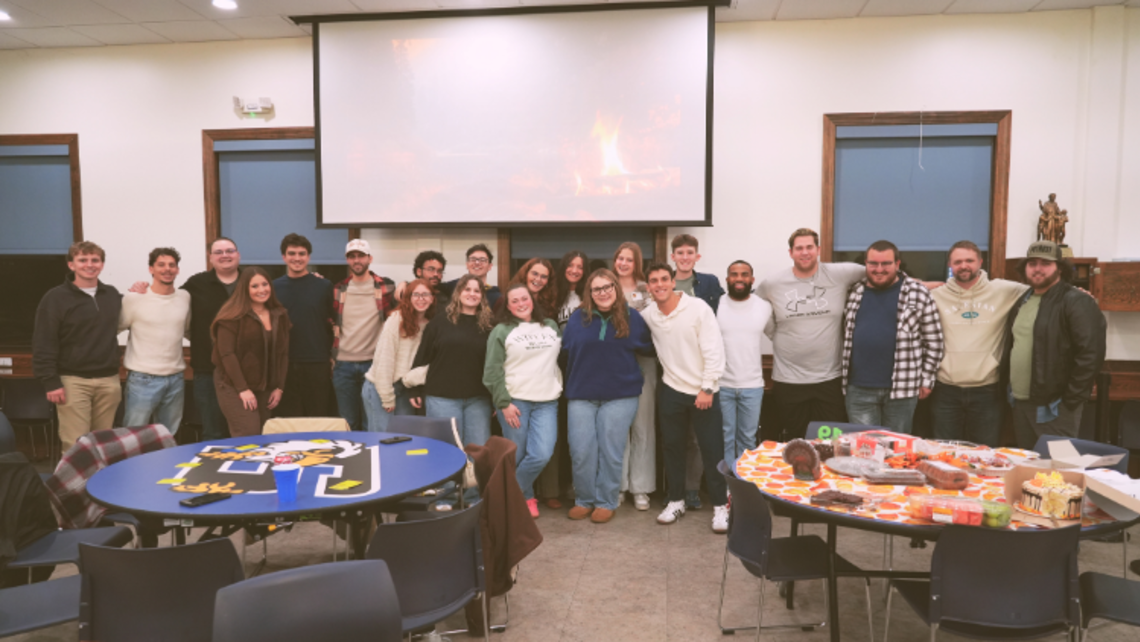 Group photo of Friendsgiving attendees | Credit: Amy Stockinger Friendsgiving 2025