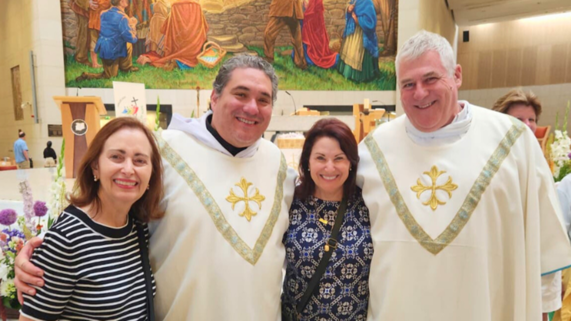 Two pilgrims pose with Frs. Manny Gallo (second from the left) and Steve Ryan (right), SDBs, at Our Lady of Knock Shrine. | Credit: Fr. Manny Gallo, SDB Ireland Pilgrimage