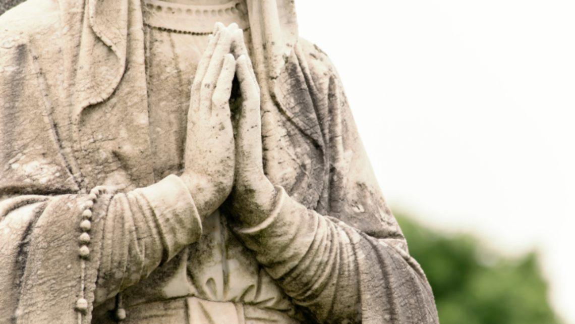 Statue of Mother Mary praying | Photo by mzajac from Getty Images Signature October Monthly Mass in Goshen