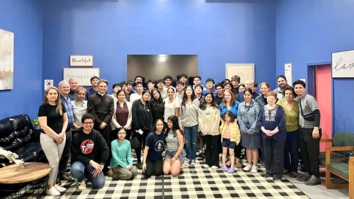 Fr. Fabio Vieira (fourth from the left, standing) with Salesian Cooperators and young people at the St. John Bosco Youth Center. | Courtesy of Ms. Meg Fraino-Rodriguez, Salesian Cooperator Port Chester: Bl. Carlo Event