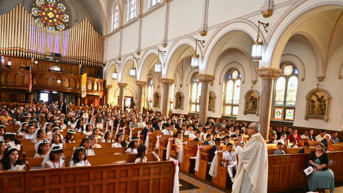 St. John Bosco Parish’s Pastor Fr. Franco Pinto, SDB, speaks to the first communicants. | Credit: Fr. Eddie Chincha, SDB Port Chester: First Communions