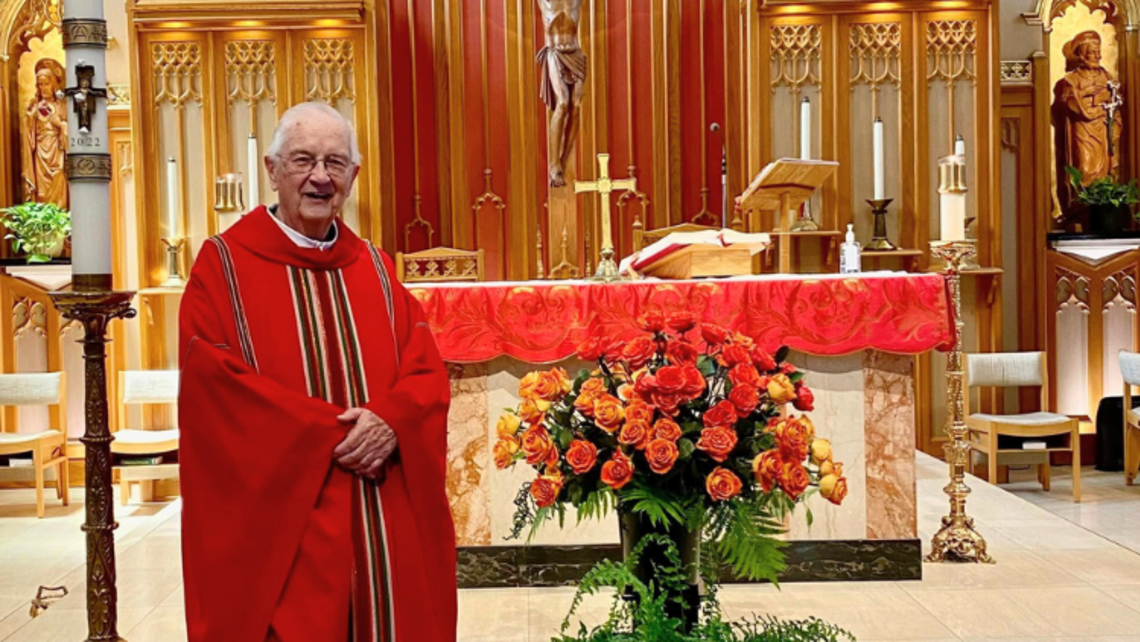 Fr. Kelly with orange, red, and yellow roses | Credit: Rosina Di Felice, Salesian Cooperator Rest in Peace, Fr. Kelly