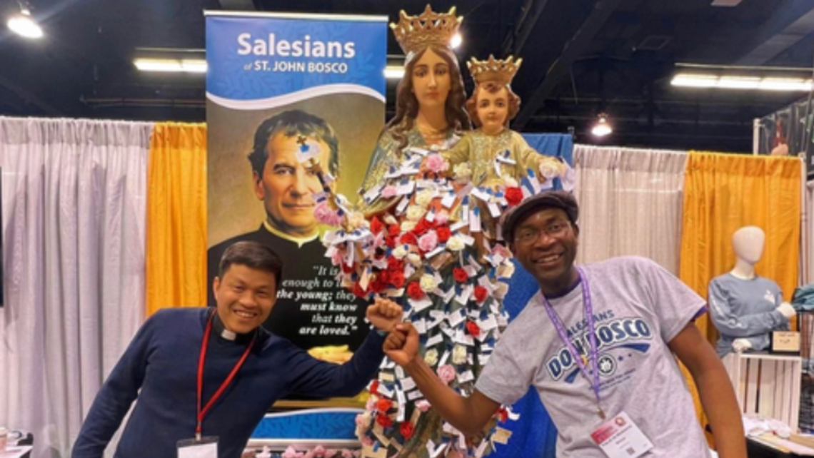 (from left to right) Fr. Vien and Novice Pascal at the Salesians' booth | Photo by Novice John Taylor Salesian at LA Religious Education Congress