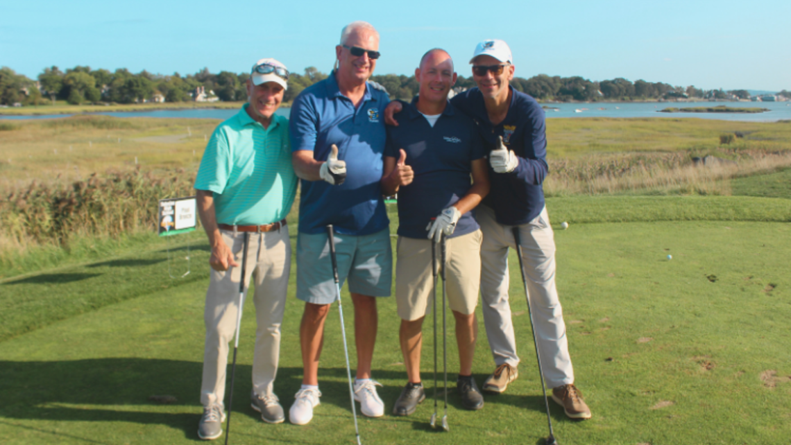Four attendees in joyful moment at the golf outing | Credit: Randy Taveras Salesian High's 30th Golf Outing