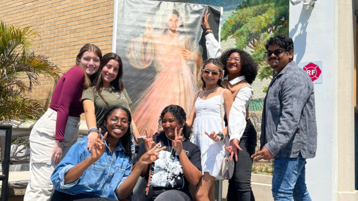 Tampa CYM Chioma Okoye (second from left) with young people on Divine Mercy Sunday | Photo courtesy of Mary Help of Christians Center Tampa's Facebook SYM Corner 05.24.23