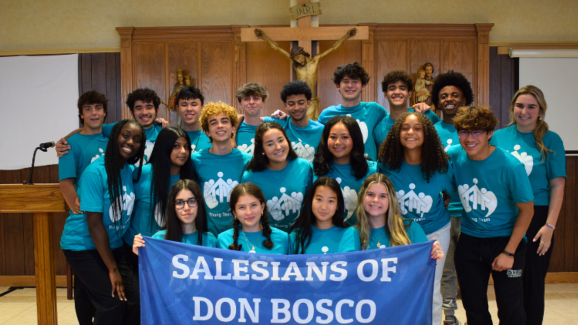 Members of the October SLR young team pose with the Salesian flag. | Photo by Mrs. Amy Stockinger Vocation Awareness Week 2024