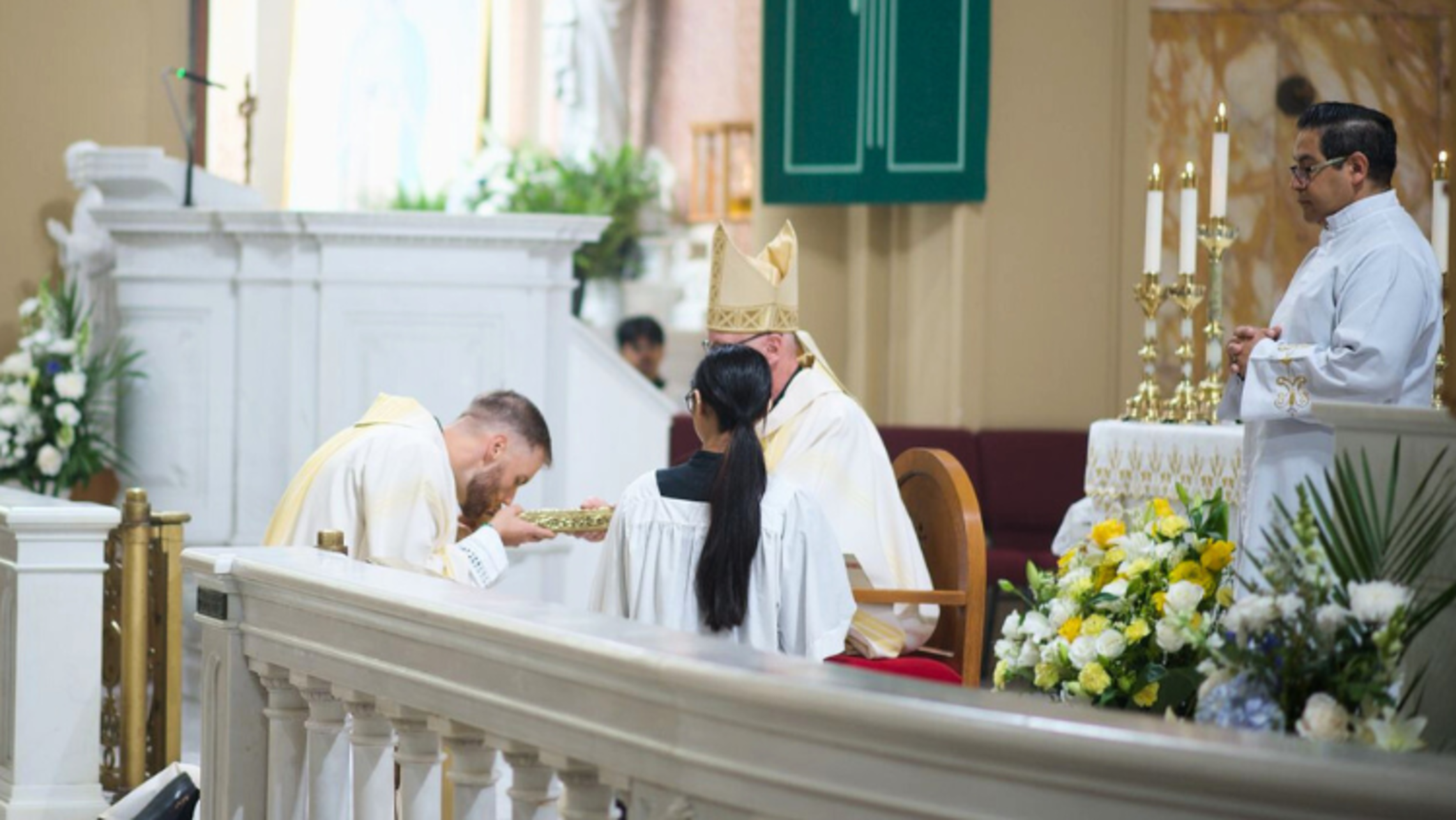 Dcn. Tom Junis, SDB, with the Book of Gospels | Credit: Ms. Vicky Weekley, Director of Youth and Young Adult Ministry Dcn. Tom Junis Ordination