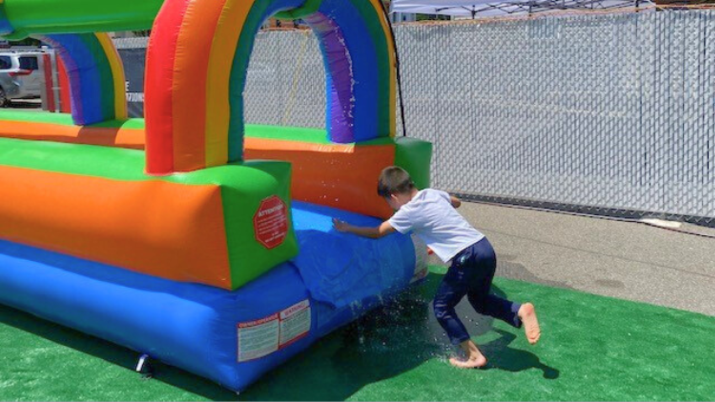 A camper is excited to enter the slip n’ slide. | Credit: Bro. Bob Metell, SDB East Boston: Hot Steam'n Time 2025