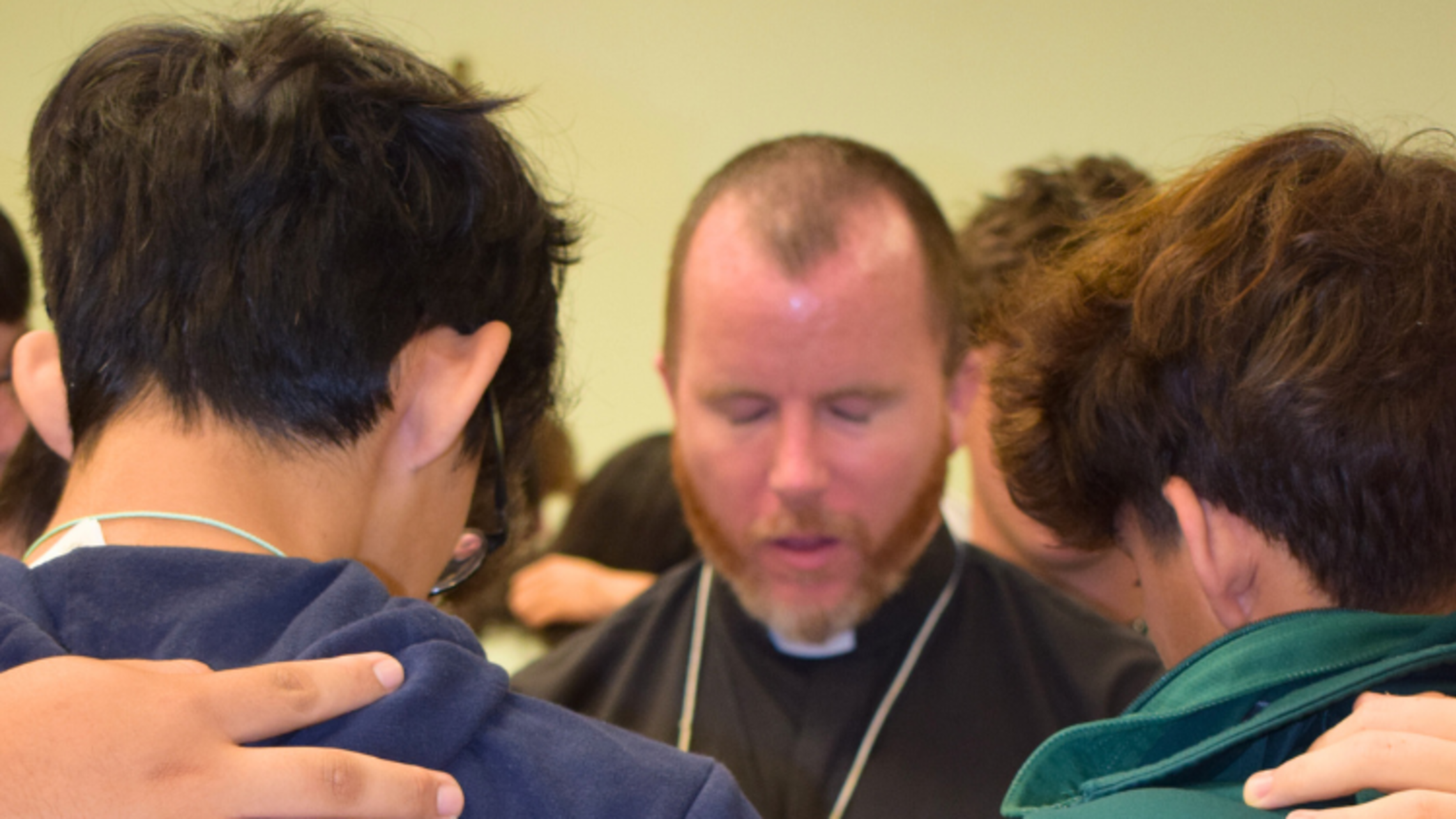 Fr. John Langan, SDB, prays with young people at a Salesian Leadership Retreat (SLR). | Courtesy of Bro. Rafael Vargas, SDB National Vocation Awareness Week 2024