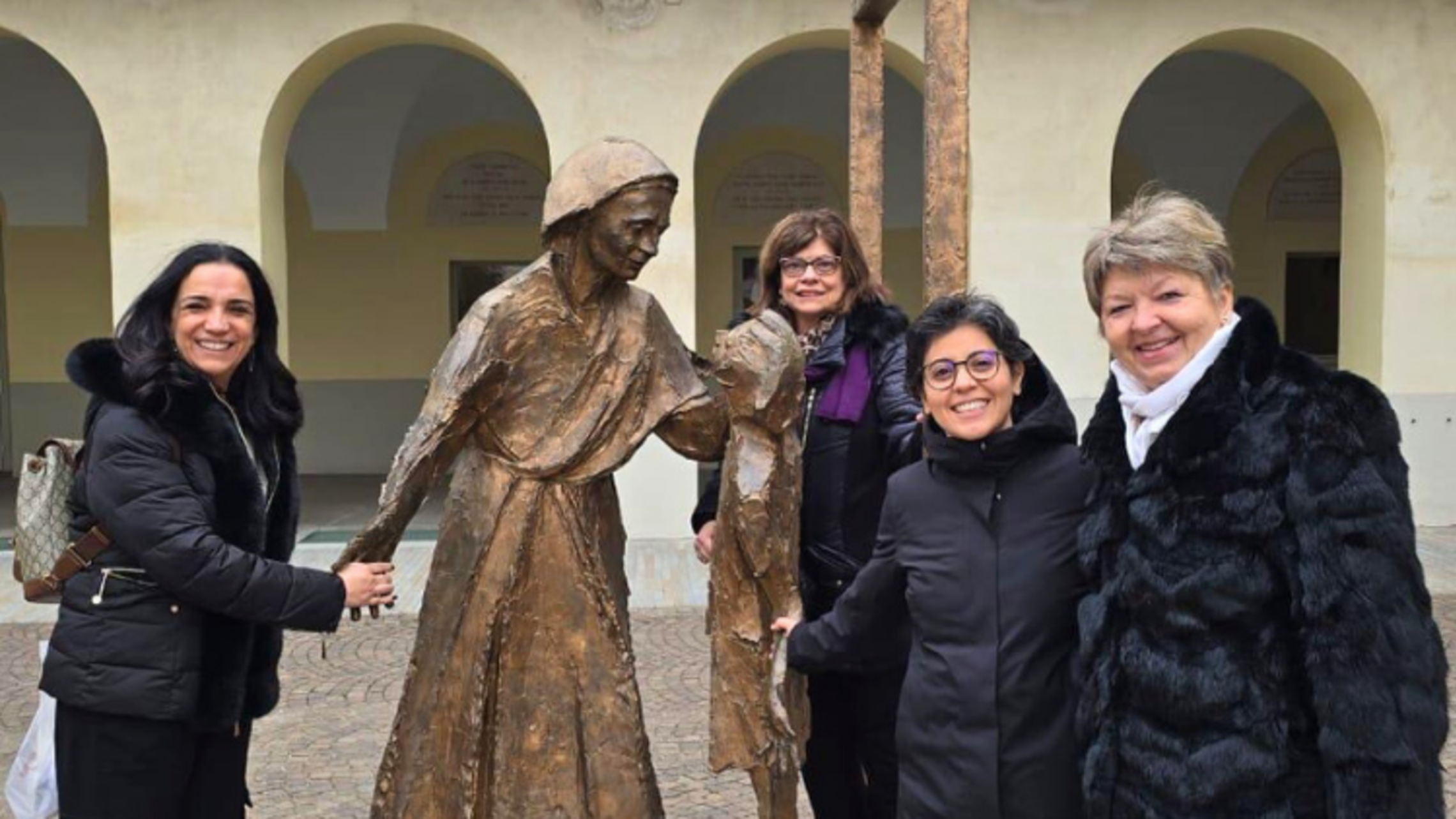 Andrea Zimmerman, Salesian Family SDB Delegate (center), gathered at the statue of Mama Margaret in Valdocco with fellow Salesian Family members during the 2025 Spirituality Days. Credit: Andrea Zimmerman, Salesian Family SDB Delegate, Salesian Cooperator SFSDs 2026 Consider Attending