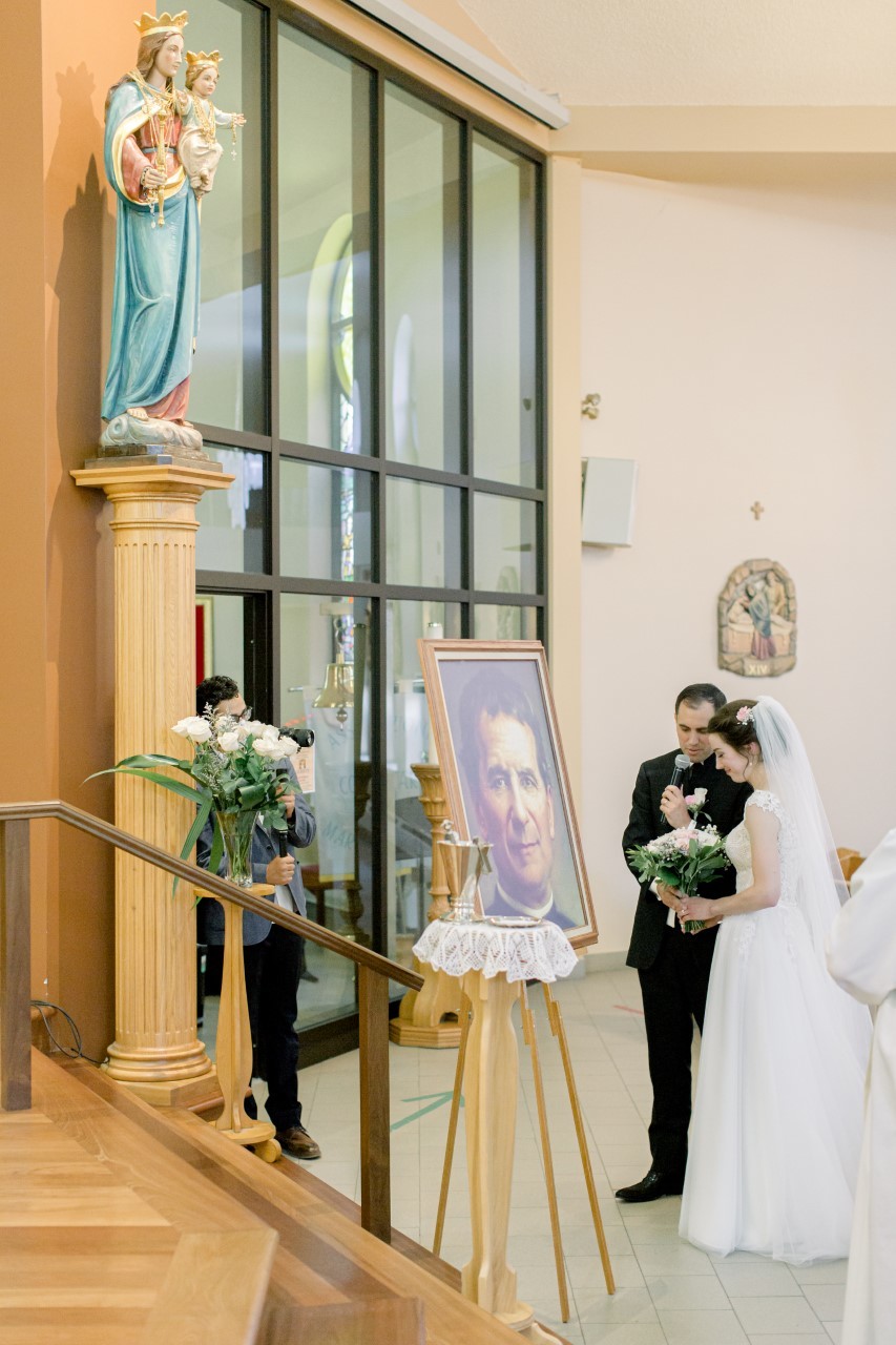 Praying to Mary during our wedding ceremony asking her to bless our marriage and to continue to watch over us.